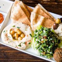 Mezze Platter · A hearty platter of our freshest Babaganoush (Mashed Eggplant), Tabbouleh (Finely Chopped Pa...