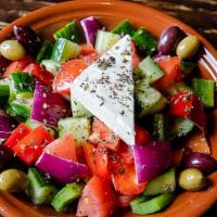Horiatiki · A freshly mixed salad made with organically tossed Tomatoes, Persian Cucumber, Kalamata Oliv...