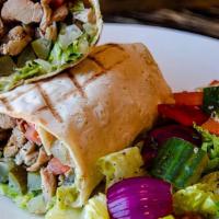 Chicken Shawarma Wrap · A traditional Lavash Wrap with a spread of our Housemade Hummus, Garlic Yogurt, and thinly s...