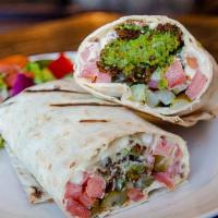 Falafel Wrap · Our handmade to order Falafel inside a Lavash Wrap with a spread of Housemade Hummus and Tah...