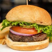 Classic Beef Burger · Topped with Tomatoes, Onions, Pickles, Spicy Aioli, and Green Leaf Lettuce. Served with a si...