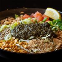 Tea Leaf Salad · Gluten free. A mix of burmese tea leaves, fried garlic, yellow beans, peanuts, sesame seeds,...