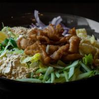 Burmese Chicken Salad · Bite-sized fried chicken with red onions, yellow bean powder, cabbage, cilantro, fried wanto...
