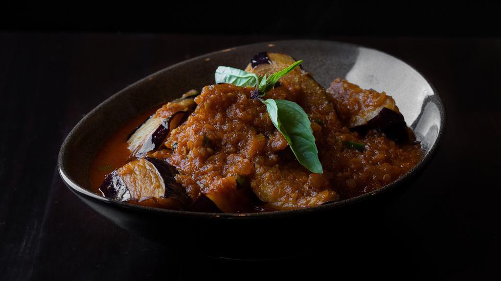 Burmese Eggplant Curry · Gluten free. Onion based curry with eggplant, ginger, garlic, paprika, turmeric, tamarind and masala.