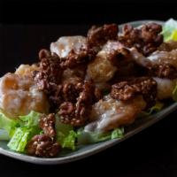 Walnut Shrimp · Lightly fried shrimp tossed in a wok with sweet sauce, topped with toasted walnuts, and sesa...