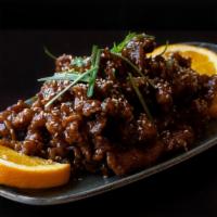 Sesame Chicken · Hand-cut strips of chicken, lightly fried in soy sauce, vinegar, honey, topped with sesame s...