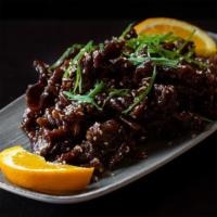 Sesame Beef · Hand-cut strips of beef, lightly fried in soy sauce, vinegar, honey, topped with sesame seed...