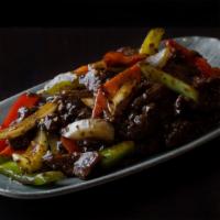 Black Pepper Beef · Marinated beef with onions, red and green bell peppers, celery, carrots, ginger, garlic, sca...