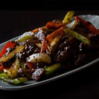 Black Pepper Lamb · Marinated lamb with onions, red and green bell peppers, celery, carrots, ginger, garlic scal...