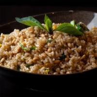 Pinenut Fried Rice · Gluten free. Brown rice with pine nuts, pea leaves, eggs and garlic.