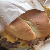 Hangover Burger · Bacon, fried over-medium egg, cheese, garlic aioli, ketchup.
