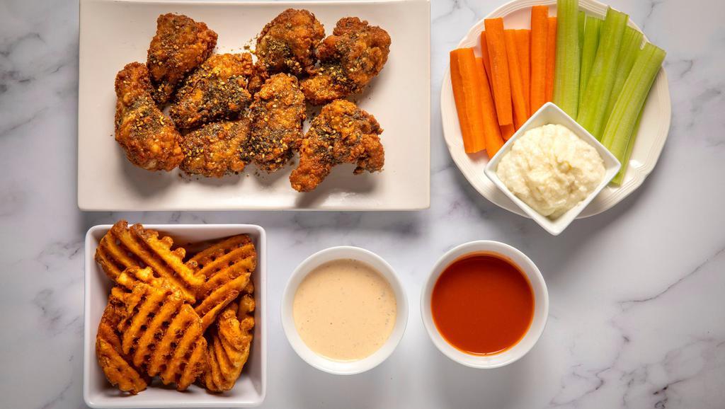 8 Wings Combo · With your choice of 2 flavors and 2 dips. Comes with a side and veggie sticks.