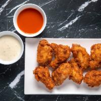 8 Wings · With your choice of 2 flavors and 2 dips.