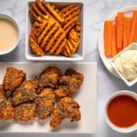 8 Boneless Wings Combo · With your choice of 2 flavors and 2 dips. Comes with a side and veggie sticks.