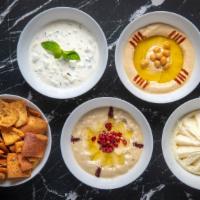 Pita Chips & Dip · With your choice of hummus, tzatziki, garlic spread or babaganoush.