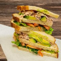 10. The Triple Decker Club · Turkey, bacon, Jack cheese, avocado, mayo, lettuce, tomato on sliced bread.