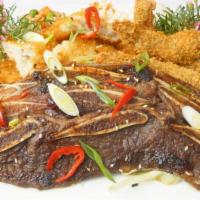 Surf & Turf · Freshly fried shrimp, island fish and choice of one protein: BBQ Chicken, BBQ Beef or BBQ Rib.