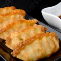 Fried Gyozas (6) · Enjoy this delicious dumplings that filled with ground pork and vegetables.