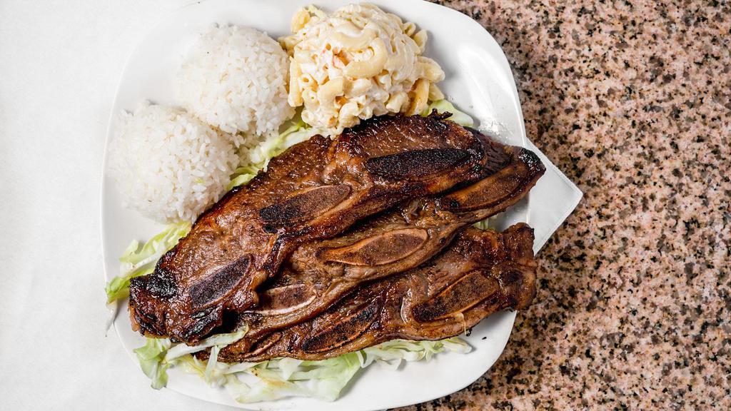 BBQ Short Ribs · Marinated beef ribs grilled to perfection.