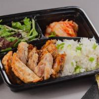 The Chicken Combo Bento Box · A bento box with your choice of 2 chicken styles and your choice of either white rice or cho...