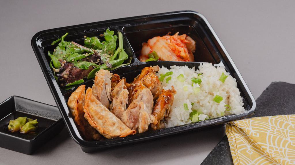 The Chicken Combo Bento Box · A bento box with your choice of 2 chicken styles and your choice of either white rice or chow mein noodles with 2 sides.