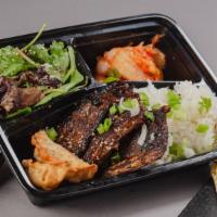Korean Short Ribs Bento Box · A bento box with korean short ribs and your choice of either white rice or chow mein noodles...