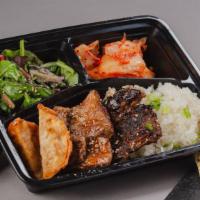 The Beef Combo Bento Box · A bento box with your choice of 2 beef styles and your choice of either white rice or chow m...