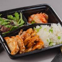 Orange Chicken Bento Box · A bento box with orange chicken and your choice of either white rice or chow mein noodles wi...
