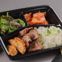 Grilled Sliced Steak Bento Box · A bento box with grilled sliced steak and your choice of either white rice or chow mein nood...