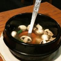 Tom Yum · Spicy and sour soup with mushrooms, tomatoes, galangal, lemongrass, and your choice of meat