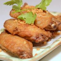 Salt & Pepper Chicken Wing · Cooked wing of a chicken coated in sauce or seasoning.