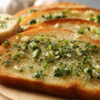 Garlic Bread (2) · Toasted bread topped with garlic pesto, and mozzarella cheese.