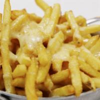 Cheese Fries · Our homemade crispy fries drizzled with yummy cheese sauce