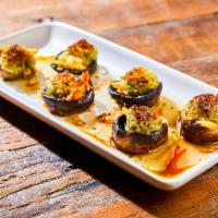 Dungeness Crab Stuffed Mushrooms · Sherry gastrique, chili cil, parsley oil, shaved salt cured egg yolks