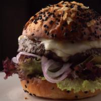 The Americana Burger · Toasted potato chip sesame bun, curio burger sauce, white American cheese, side of lettuce, ...