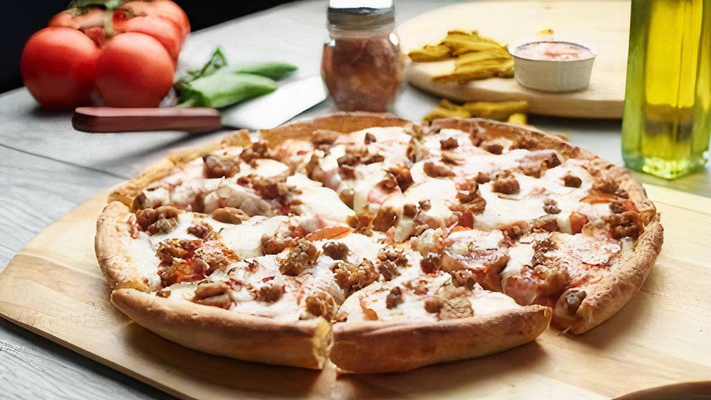 All Meat Pizza · This pizza has our signature red sauce, fresh diced mozzarella cheese, sliced pepperoni, sliced Canadian bacon, juicy Italian sausage & ground beef.