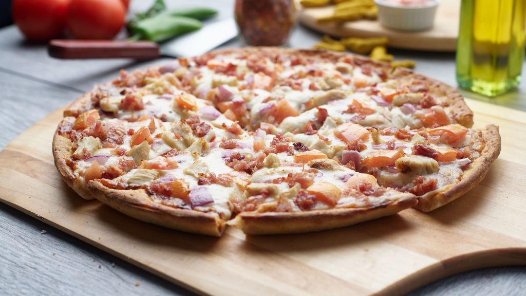 Bbq Chicken Pizza · This pizza has our signature BBQ sauce, fresh diced mozzarella cheese, crisp red onions, juicy tomatoes, All-Natural BBQ Chicken Breast & crunchy bacon.