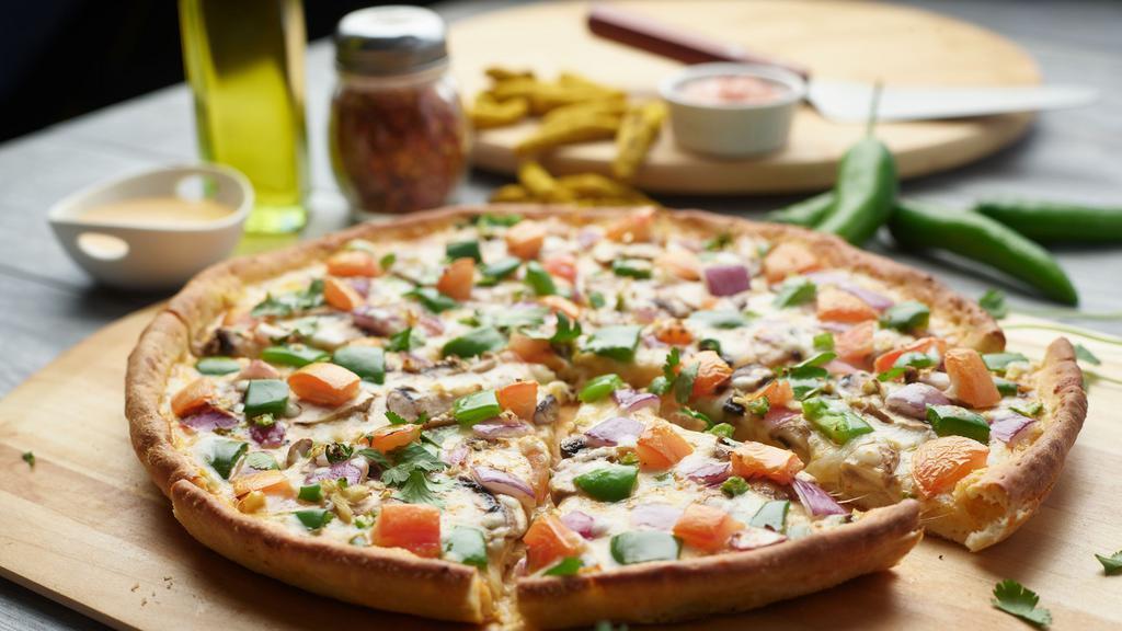 Halal Lahori Pizza Twist · This pizza has our signature butter sauce, fresh diced mozzarella cheese, halal chicken, fresh mushrooms, crisp red onions, fresh bell peppers, fresh-cut; garlic-ginger & green chilies, garnished with fresh green onions.
