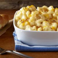 Macaroni And Cheese · Macaroni baked in a creamy alfredo and cheddar sauce.