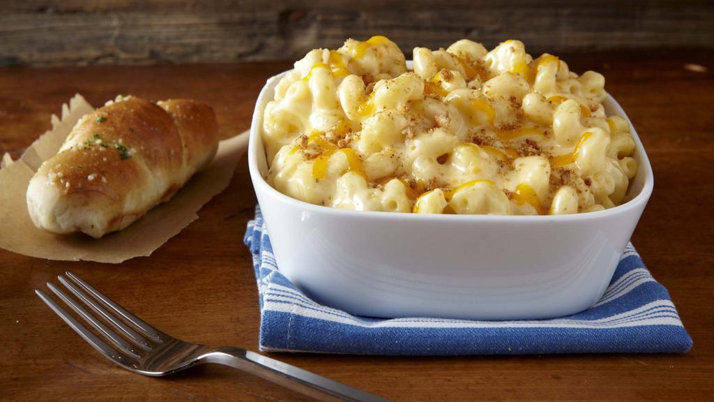 Macaroni and Cheese · Macaroni baked in a creamy alfredo and cheddar sauce.