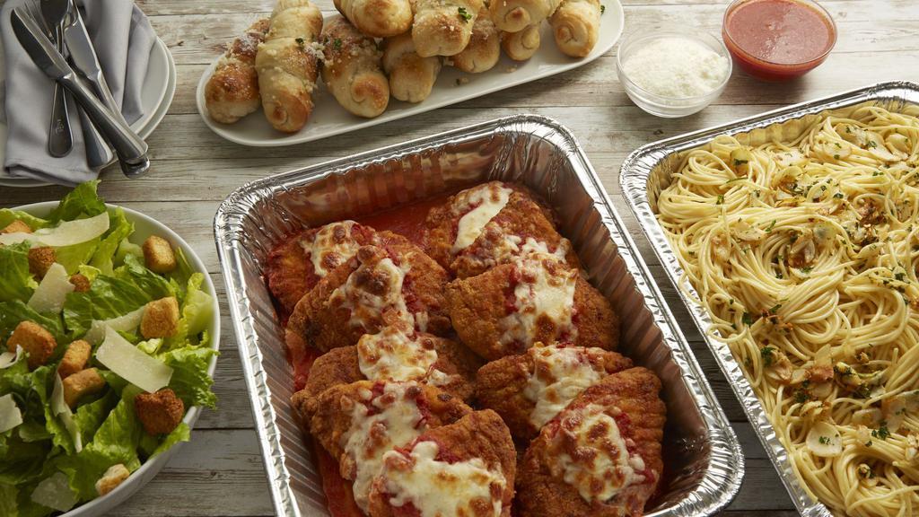 Chicken Parmesan · Breaded chicken breast a bed of spaghetti.