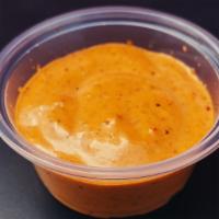 Chipotle Aioli (Dipping Sauce) 加購橘醬 · Mayonnaise base with chipotles in adobo. Sweet, smoky, spicy.