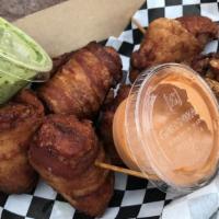 Flying Pigs · Bacon wrapped chicken nuggets.