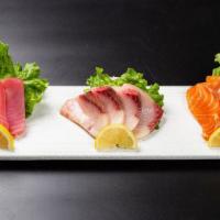 A12. Sashimi Combo (11) · Fresh sliced assorted fish.