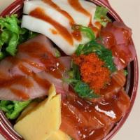 B1. Chirashi Bowl · Sliced assorted fish over rice. King Sauce. Seaweed Salad. Tobiko