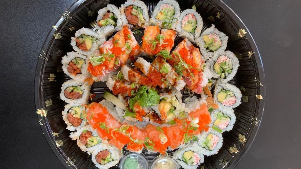T7. Volcano Tray (38) · Red dragon roll, salmon dragon roll, spicy tuna roll, california roll, shrimp tempura roll.
