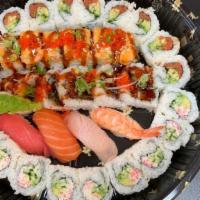 T8. Sushi Lover Tray (34) · Spicy tuna roll, California roll, lion king roll, nigiri (four), shrimp tempura roll.