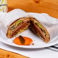 Torta Cubana · all the tortas including lettuce, tomatoes, onions, guacamole, and homemade dressing.