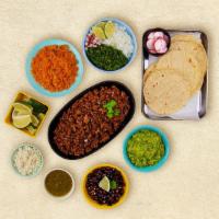 Ground Beef Taco Kit · 1 pound of protein, 12 hand-made corn tortillas, mexican rice, chopped onions, cilantro, shr...