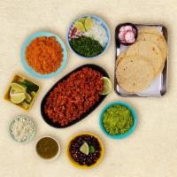 Chorizo Taco Kit · 1 pound of protein, 12 hand-made corn tortillas, mexican rice, chopped onions, cilantro, shr...